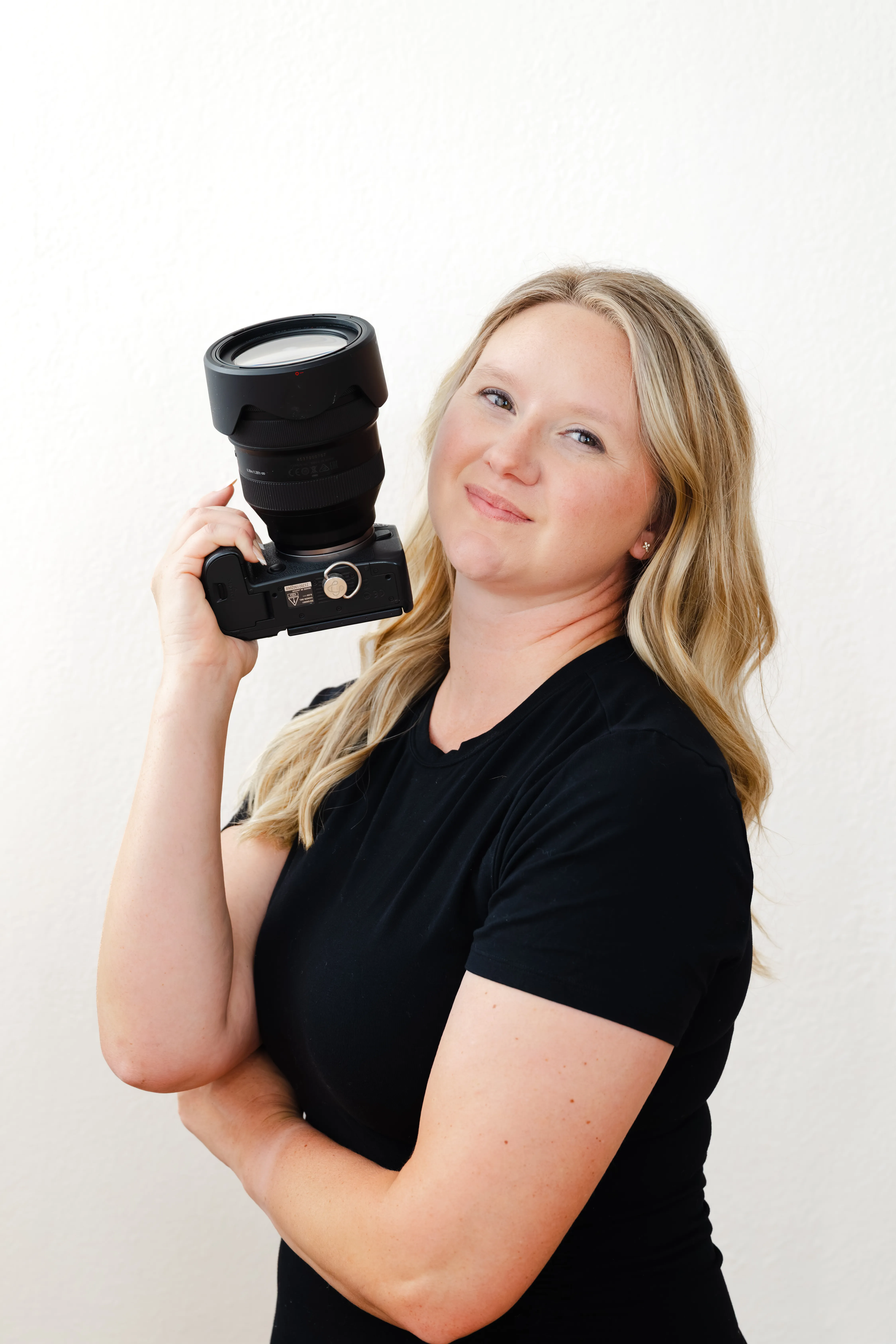 Jessica, JB Squared Photography, holding her camera